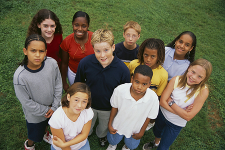 image of kids in a circle looking down at the camera